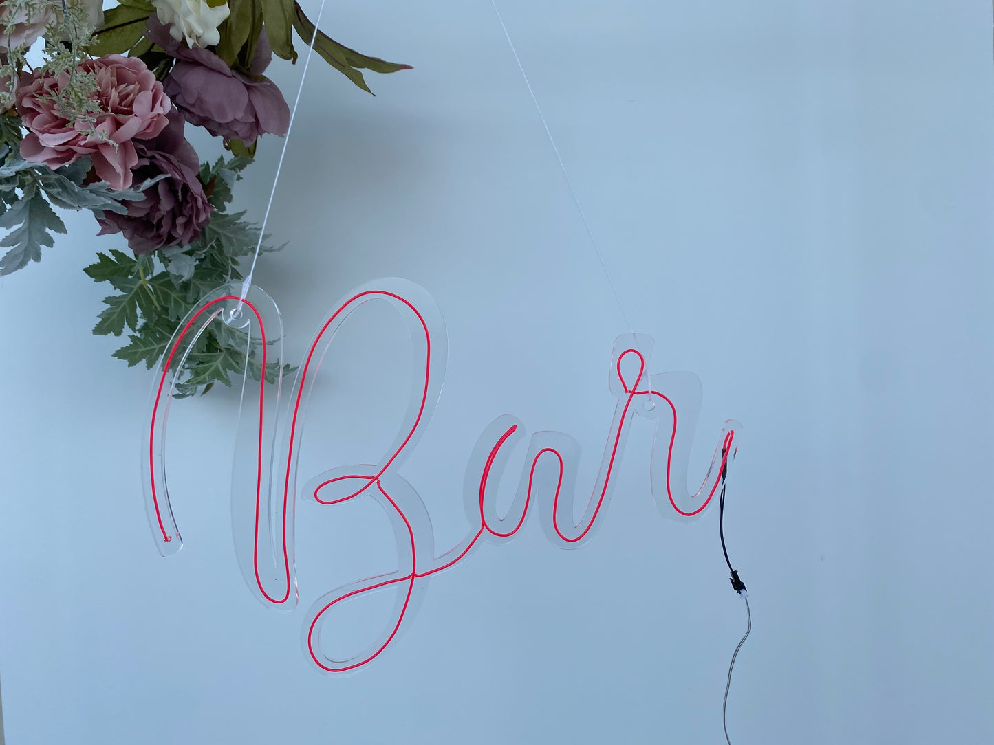 Neon wire bar sign switched off