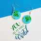 You are my whole world fun kawaii based earth earrings shown in a pair on a mixed media background