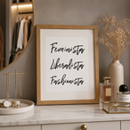 Framed monochrome print with handwritten 'Feminista Liberalista Fashionista'