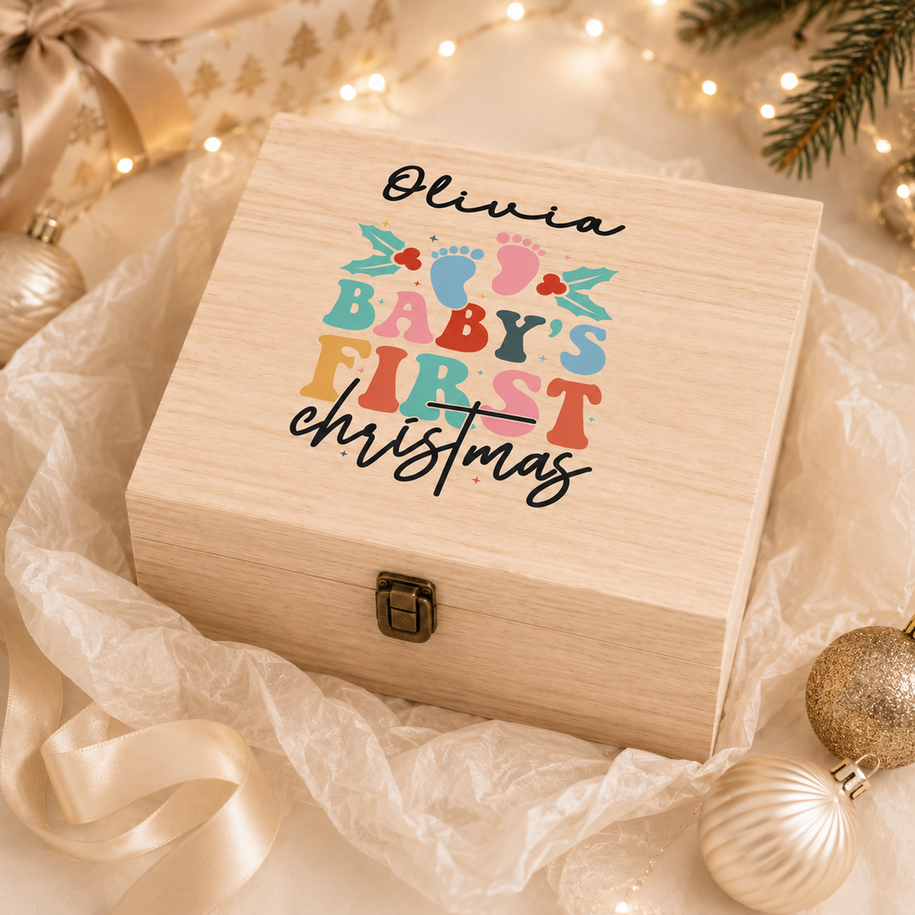 Personalised wooden Christmas Eve box with 'Olivia Baby's First Christmas' colourful design