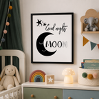 Monochrome nursery print with a crescent moon and stars, 'Good night moon', framed on a shelf