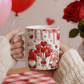 Hands holding a 3D-effect Valentine's mug with gnomes and red heart balloons