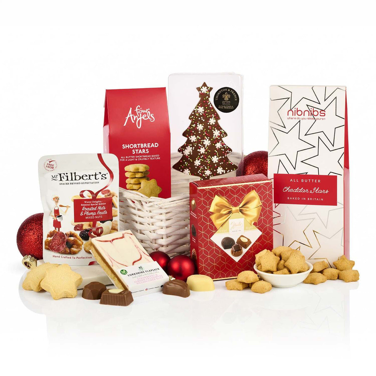 Christmas Treats Basket Hamper with shortbread stars, pralines, a chocolate Christmas tree, cheddar stars and flapjack