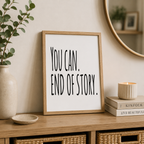 Motivational print reading 'You can. End of story.' in black lettering, framed on a sideboard