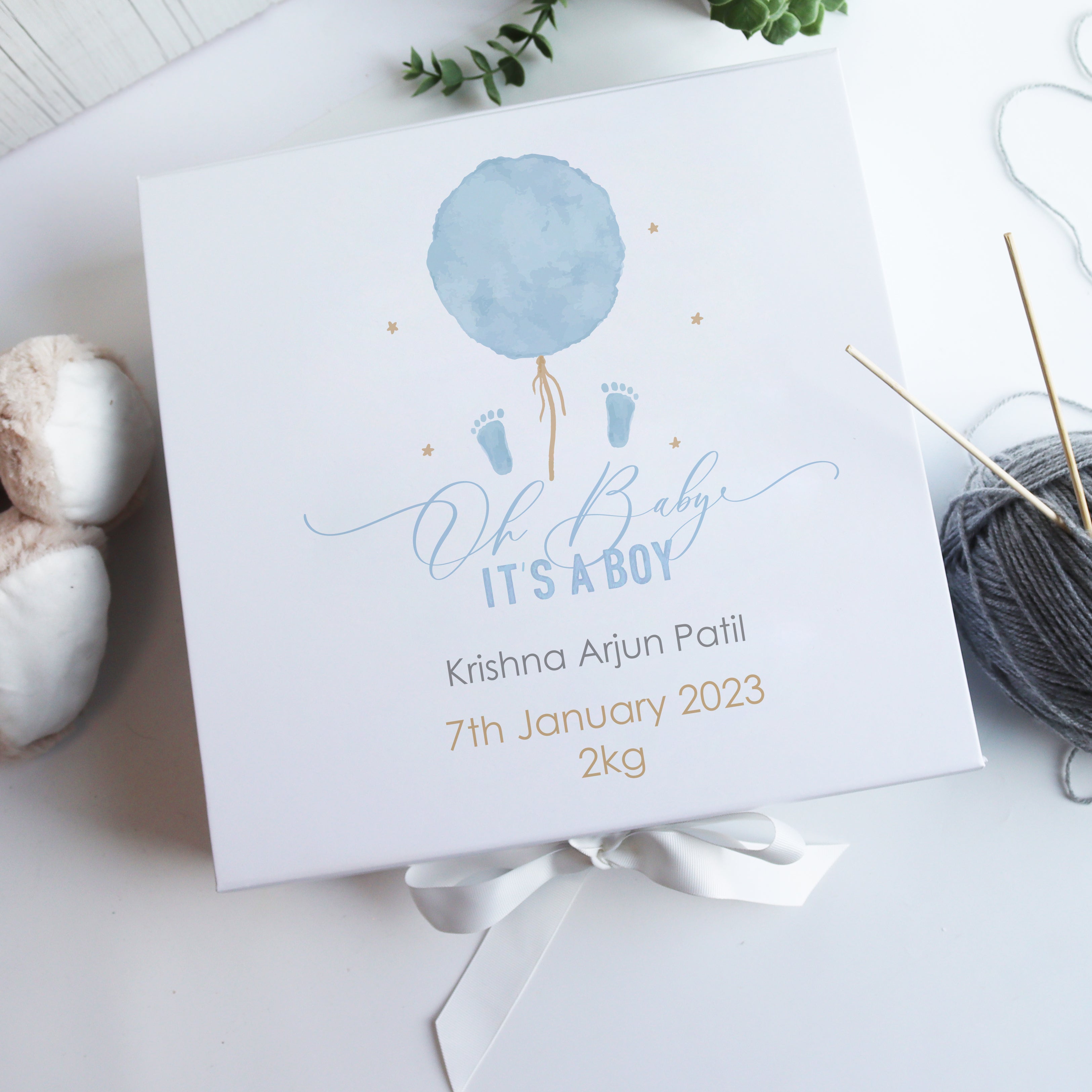 Personalised white luxury baby gift box with watercolour balloon and bear design, customised with baby name, birth date, and weight.