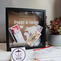 Black shadow box with acrylic front for storing tickets and souvenirs