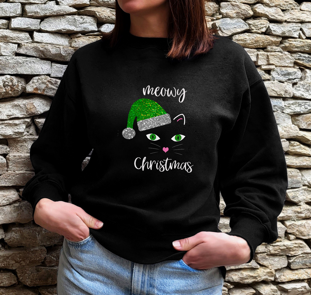 Black 'Meowy Christmas' jumper with a glittery cat face in a green santa hat