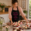 Black personalised baking apron with 'My Mum makes the best cupcakes ever' in pink