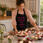 Black personalised baking apron with 'My Mum makes the best cupcakes ever' in pink