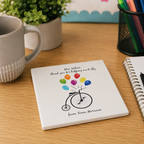 Personalised teacher coaster with a balloon penny farthing reading 'Thank you for helping me to fly'