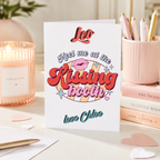 Personalised 'Meet me at the kissing booth' card with retro lips design, shown on a table