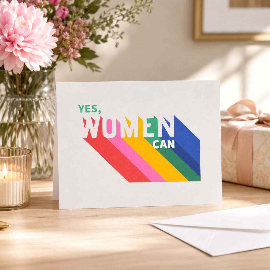 Bright 'Yes, Women Can' card with bold rainbow lettering