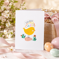'Happy Easter' card with a cheerful yellow chick standing among eggs and flowers