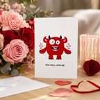 Funny Valentine's card with a red horned monster and hearts, reading 'You will love me'