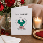 Funny Valentine's card with a smiling cactus, reading 'You're stuck with me'