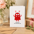 Funny Valentine's card with a red monster and hearts, reading 'I love you just the way I am'