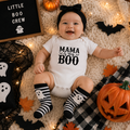Baby in white 'Mama is my Boo' Halloween baby grow with ghost socks and pumpkin
