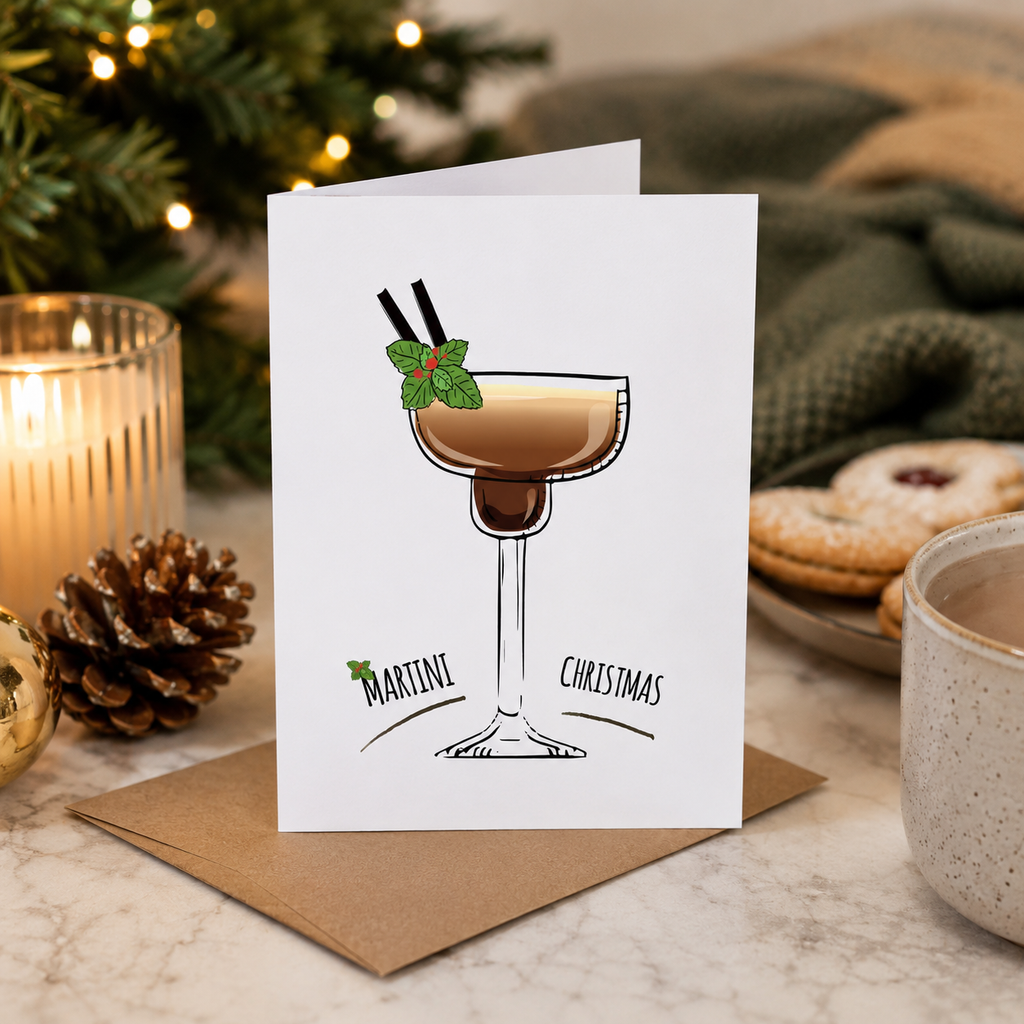 Espresso martini Christmas card propped beside festive decorations