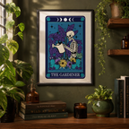 Framed tarot style print 'The Gardener' with skeleton watering plants, on a green wall