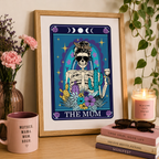'The Mum' wine tarot style print with skeleton and flowers, framed on a wall