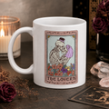 White mug with a tarot style 'The Lovers' design of two skeletons
