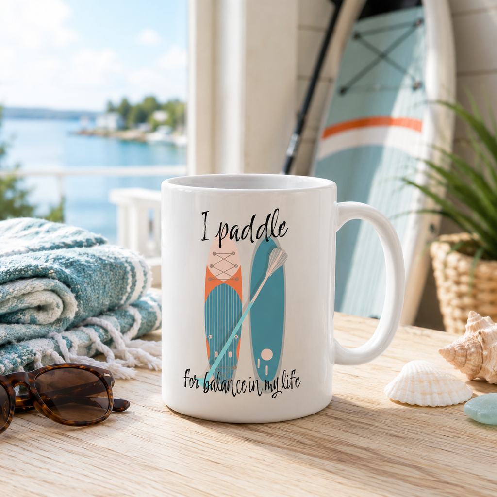 White mug reading 'I paddle for balance in my life' with a paddleboard and paddle design