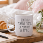 Funny grumpy mug with 'I don't like morning people' slogan design