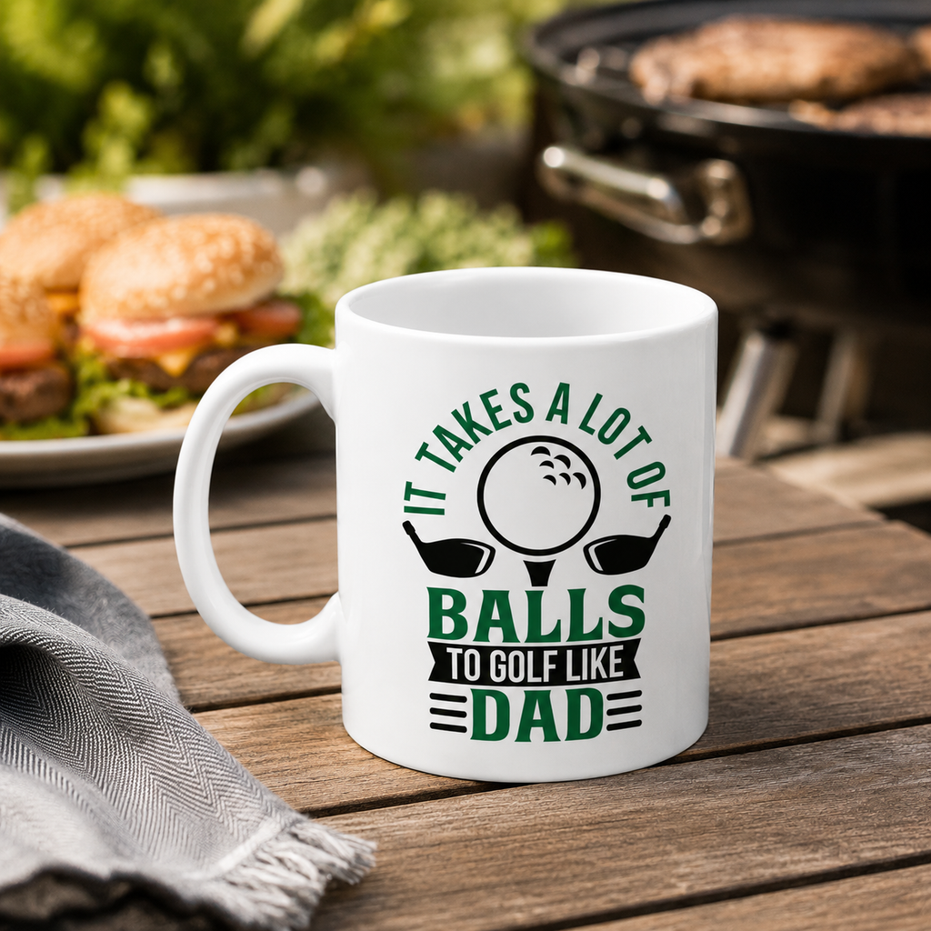 Funny golf mug reading 'It takes a lot of balls to golf like Dad' with golf club design
