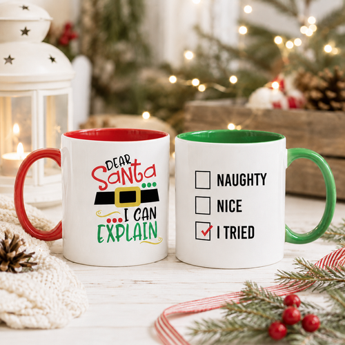 Two Christmas mugs, one 'Dear Santa I Can Explain' with red handle, one naughty nice checklist with green handle