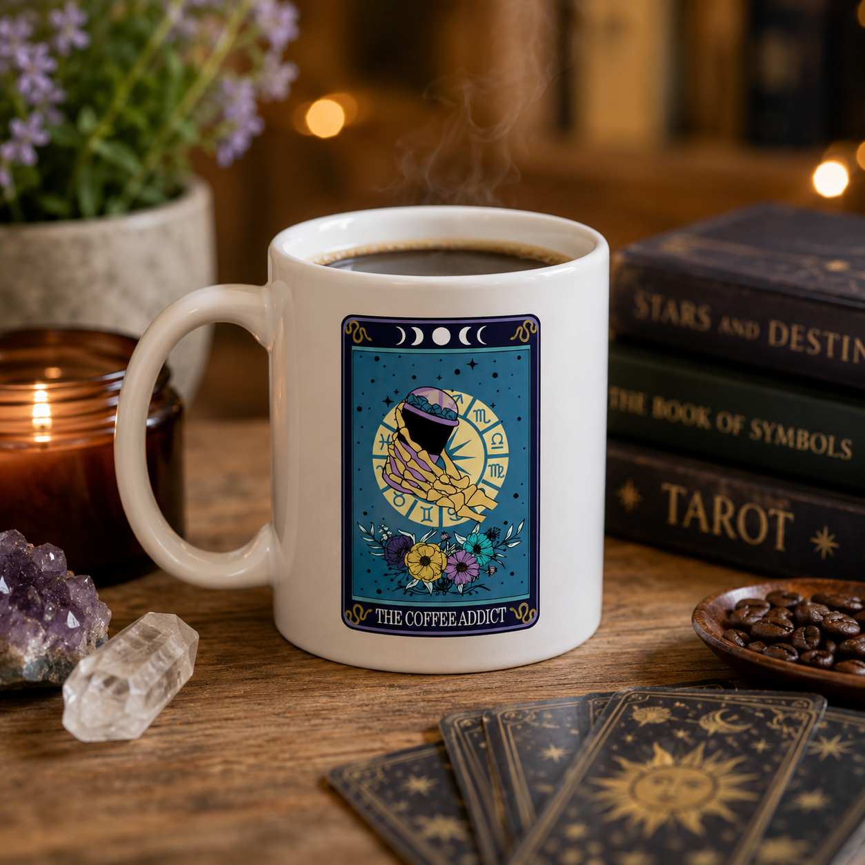 White mug with 'The coffee addict' tarot card design, filled with coffee on a wooden table