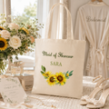 Personalised tote bag printed 'Maid of Honour Sara' with a sunflower design, natural canvas