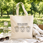 Natural cotton tote bag reading 'Proudly watching the lionesses roar' with three crowned lioness faces