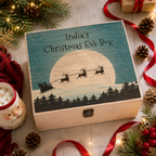 Personalised wooden Christmas Eve box with a festive sleigh scene, styled with garland and baubles