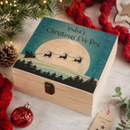 Personalised wooden Christmas Eve box with a sleigh and moon design reading 'India's Christmas Eve Box'