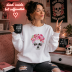 White sweatshirt with pink floral skull design topped with roses
