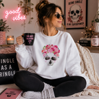 Pink rose and skull design on a soft white sweatshirt