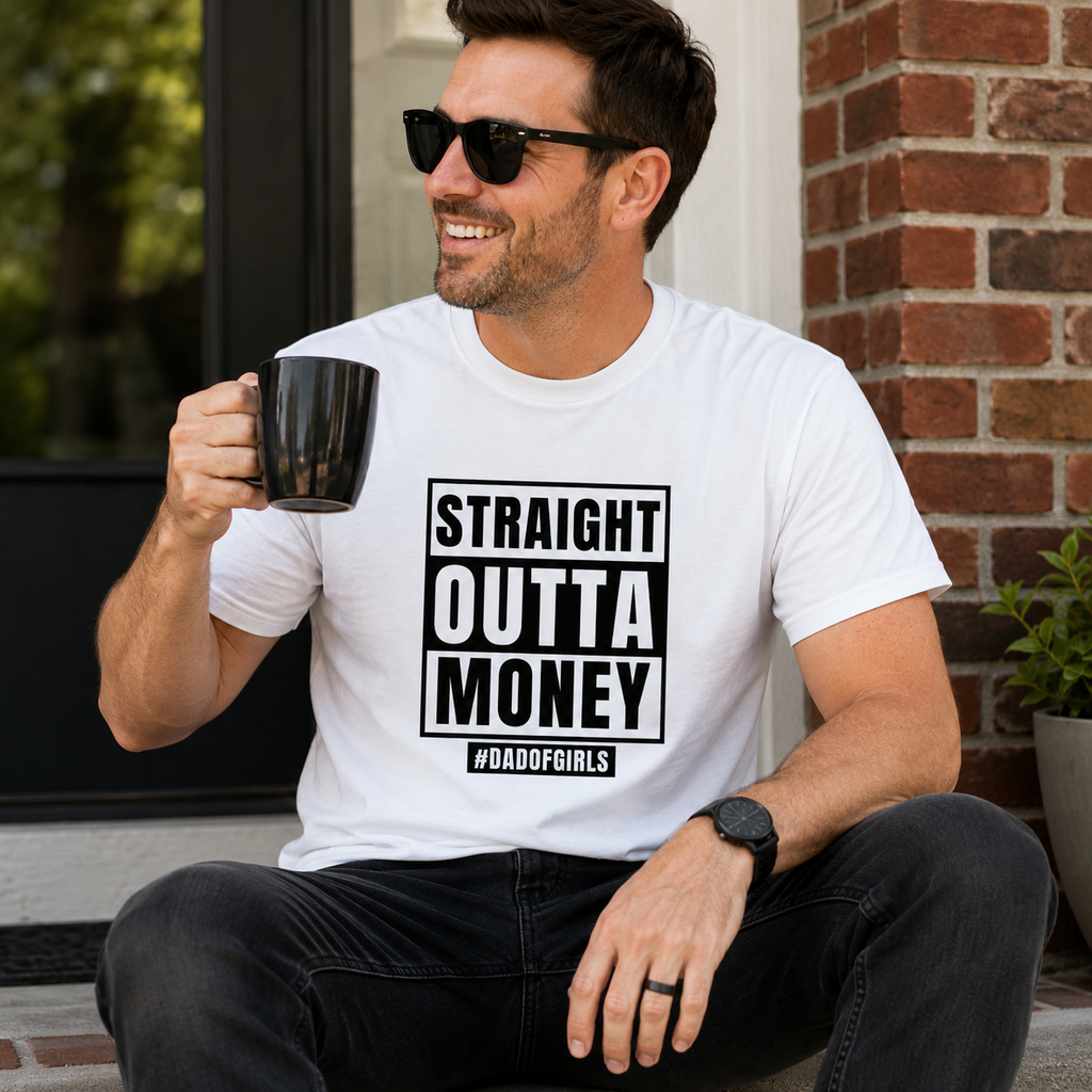 White t-shirt with bold 'Straight Outta Money' and '#dadofgirls' design