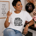 Woman wearing a white 40th birthday t-shirt reading 'Sassy & fabulous at 40'
