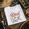 White folded t-shirt with retro 'Reel Cool Dad' fishing rod and fish design