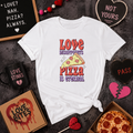 White t-shirt with a pizza slice reading 'Love disappoints, pizza is eternal'