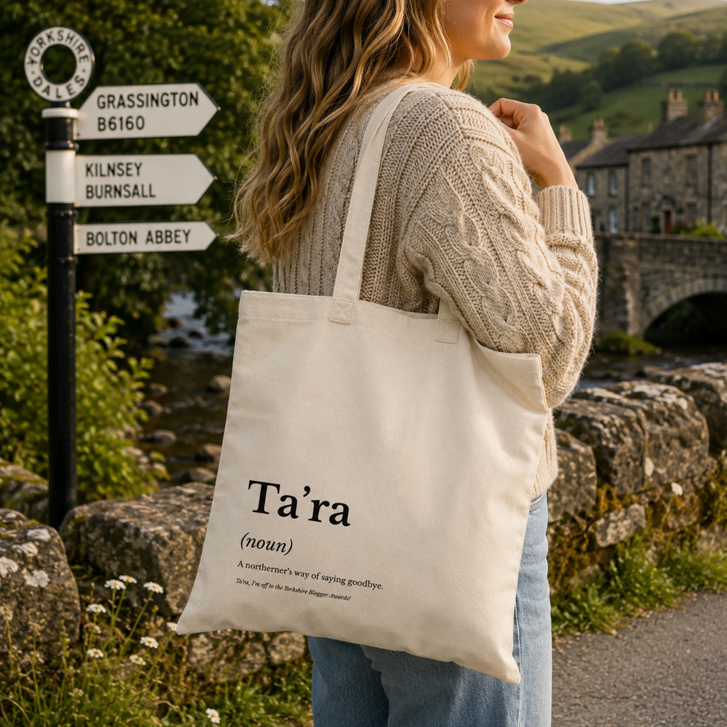 Cotton tote bag printed with a 'Ta'ra' dictionary definition, carried over the shoulder in the Dales