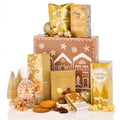 The Christmas Gift Box Hamper with caramel popcorn, fudge, gingerbread, pralines and Gouda biscuits by a gingerbread print box