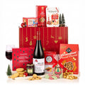 The Redsleeves Hamper with a bottle of Pico a Pico Merlot Carmenère, mince pies, popcorn, oat crumbles and jam by a red Christmas gift box