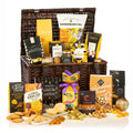 The Fireside Feast Hamper (Alcohol Free) with chocolate, fudge, cheese wafers, popcorn, mince pies and fruit jellies in a brown basket