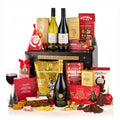 The Excelsior Gift Box Hamper with Bottega Prosecco, red and white wine, mince pies, fruit cake and chocolates by a black gift box