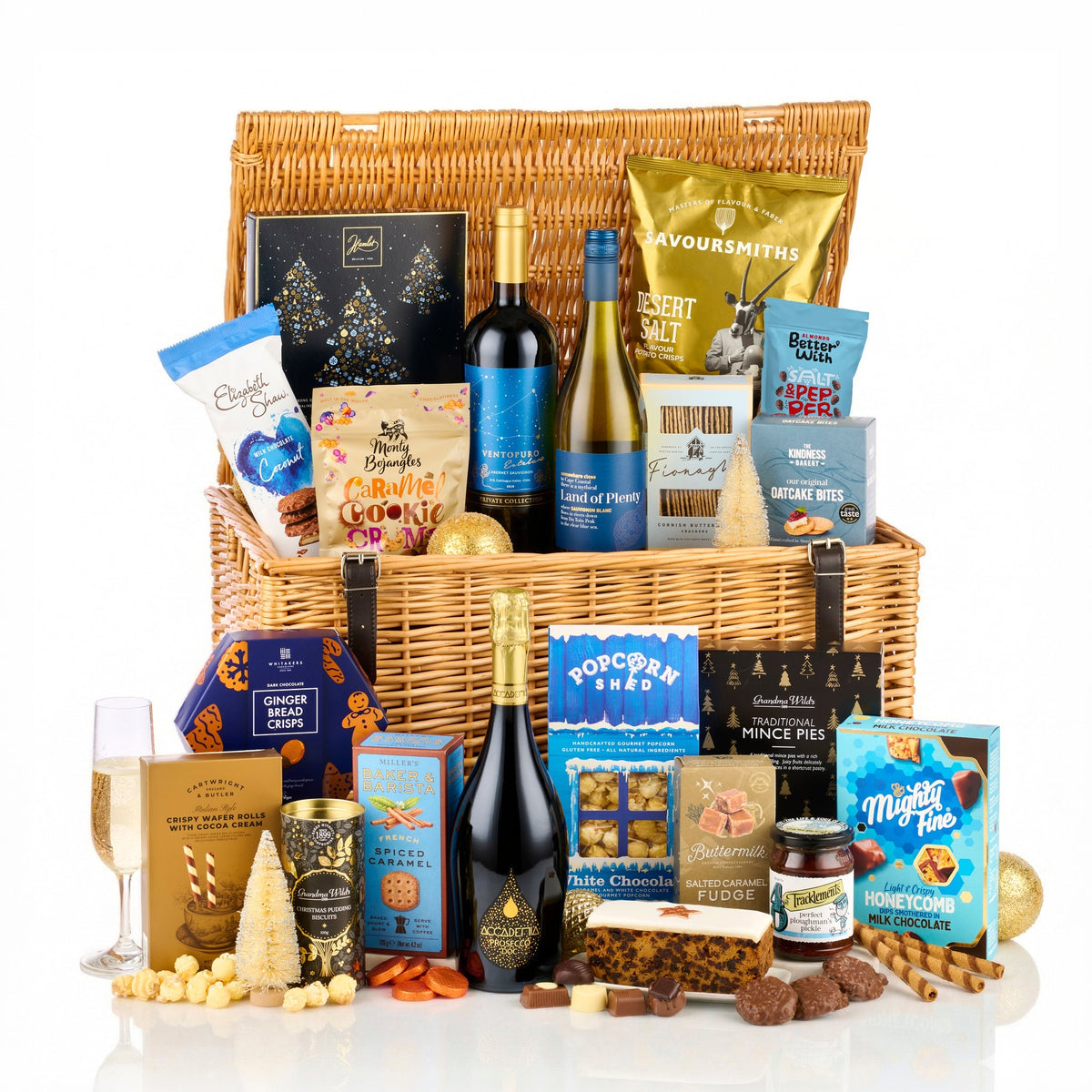 The Christmas Eve Hamper with Prosecco, red and white wine, fruit cake, mince pies, popcorn and chocolates in a wicker basket