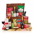 The Holly & The Ivy Hamper with Bottega Prosecco, Pico a Pico wines, a Malbec, mince pies, fruit cake and treats in a wicker basket