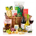 Festive Sharing Hamper with Pico a Pico red and white wine, Stilton, cheddars, crackers, olives and crisps in a wicker basket
