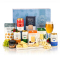 Beer & Cheese Gift Box Hamper with four cans of Freedom beer, two cheddars, black pepper crackers and onion chutney by a blue gift box