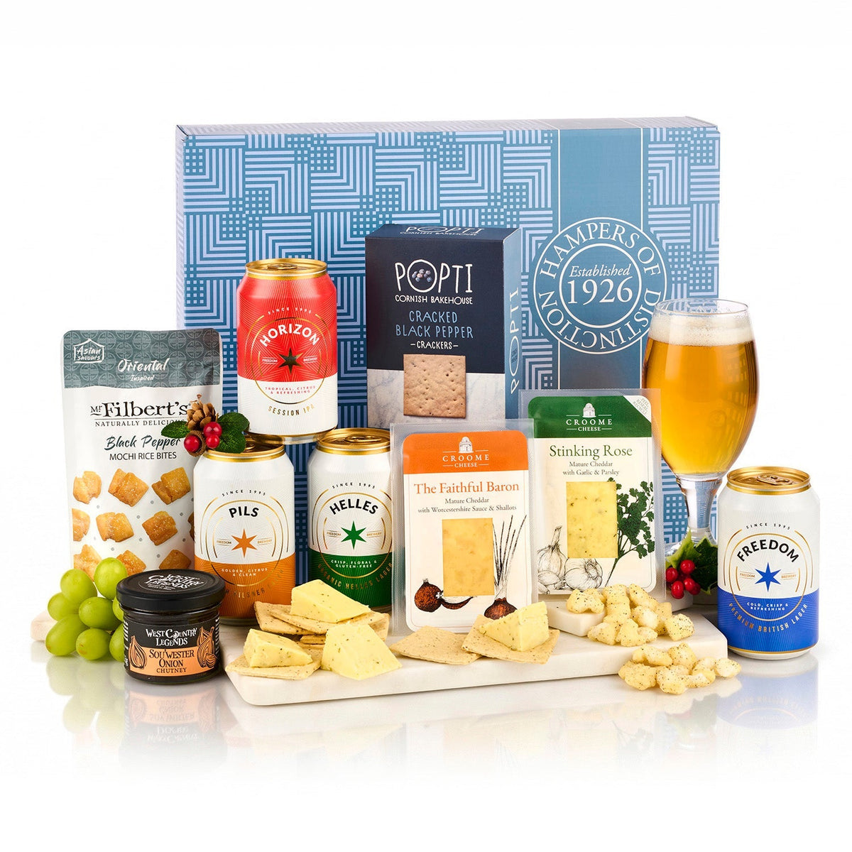 Beer & Cheese Gift Box Hamper with four cans of Freedom beer, two cheddars, black pepper crackers and onion chutney by a blue gift box